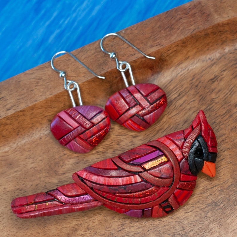 Photo shows bright red dangle mosaic earrings in an inverted triangle shape. The wires are shiny Sterling silver. Cardinal brooch is a coordinating piece available in a separate listing. See description for link.