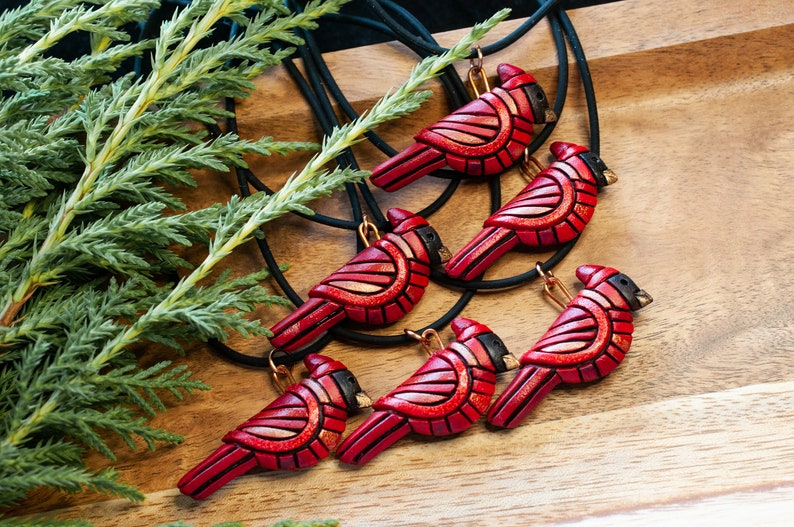 Photo shows 6 bright red mini cardinal mosaic pendants on black cords (Listing includes one cardinal)