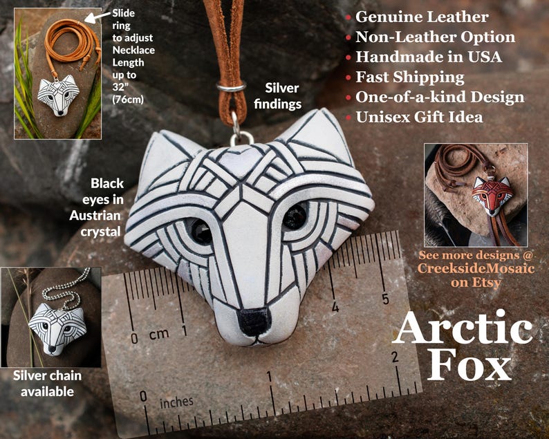 White Arctic fox necklace made in mosaic style is shown from the front. Pendant hangs from an adjustable tan leather cord. Eyes are sparkling black crystals. Text is added to show all of the unique details of this piece.