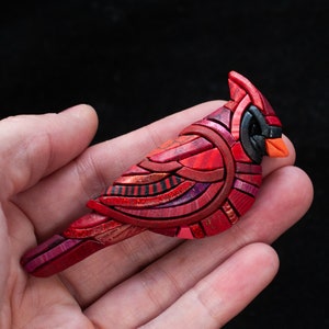 Photo shows one red male Mosaic Cardinal Brooch in a hand to show scale.