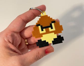 Llavero de Goomba de Super Mario – Adorno retro pixelado para mochila