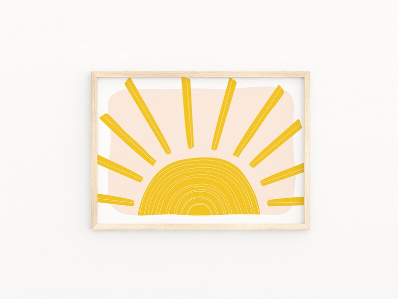 May include: A framed print of a stylised sun with yellow rays and a yellow and white arc on a pink background.