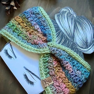 May include: A multi-colored crocheted headband with a brown tag that says "GG Crochet".
