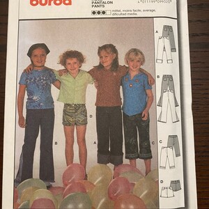 May include: Burda sewing pattern number 9932 for pants. The pattern includes four different styles of pants with instructions for sewing seams and hems. The pattern is for sizes 6-10.