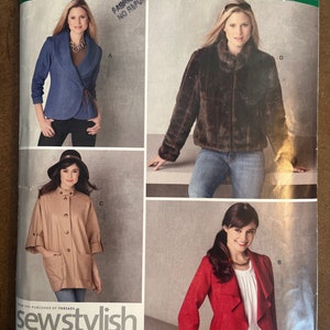 May include: A sewing pattern for three different jackets. The first jacket is a denim jacket with a shawl collar. The second jacket is a brown faux fur jacket. The third jacket is a red jacket with a shawl collar and a ruffle detail. The pattern is from Simplicity and is size H5 6, 8, 10, 12, 14. The pattern is for sizes EUR 32-40 and FR 34-42.