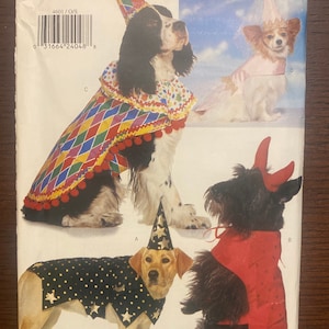 May include: A sewing pattern for four dog costumes. The costumes include a jester, a wizard, a devil, and a princess. The pattern number is 4601 and the size is O/S. All sizes are included.