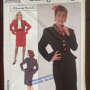 May include: Simplicity sewing pattern number 931 for a skirt and jacket. The pattern includes two views: a black skirt and jacket with a red floral trim and a red skirt and jacket with a black floral trim. The pattern is for sizes 12, 14, 16, 18, 20, 22, 24, 26, 28, 30, 32, 34, 36, 38, 40, 42, 44, 46, 48, 50, 52, and 54.