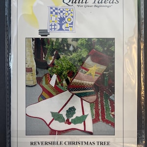 May include: A package for a sewing pattern titled "Quilt Ideas" featuring a reversible Christmas tree skirt and stocking design. The package shows a light bulb graphic and a quilt block design. The text reads "For Great Beginnings".