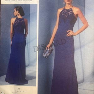 May include: A sewing pattern for a long, blue, halter-style dress with a lace bodice. The pattern is by Badgley Mischka and is for sizes 6-8-10-12-14. The pattern number is V1615/A5.