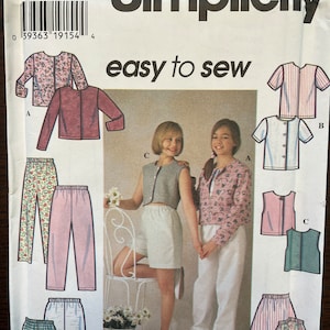 May include: Simplicity sewing pattern number 7228 for sizes AA 7, 8, and 10. The pattern includes instructions for making a variety of clothing items, including a cardigan, a vest, a pair of trousers, and a skirt. The pattern is illustrated with drawings of the finished garments.