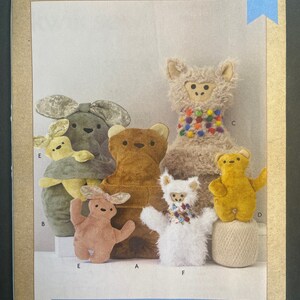 May include: A sewing pattern for plush animals, featuring six different animal designs: a llama, a bunny, a bear, a dog, a turtle, and a polar bear. The pattern is called "Kwik Sew K4361 Plush Animals".
