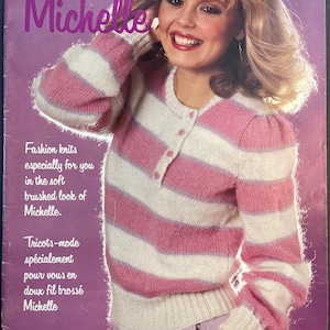 May include: A magazine cover from the 1980s showcasing a woman in a pink and white striped sweater. The cover features the name "Michelle" in purple, the Jaeger logo, and the price. The sweater has a buttoned neckline and a soft, brushed texture.