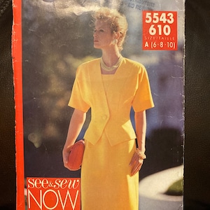 May include: A yellow and white women's suit sewing pattern with a model wearing the suit. The pattern number is 5543 610 and the size is A (6-8-10). The pattern is from the see & sew now brand.