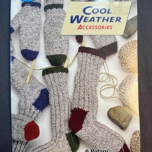 May include: A catalogue cover showing knitted socks and mittens in grey, with blue, red, and green accents. The text reads "Cool Weather Accessories" and "Shetland Ragg" by Patons.