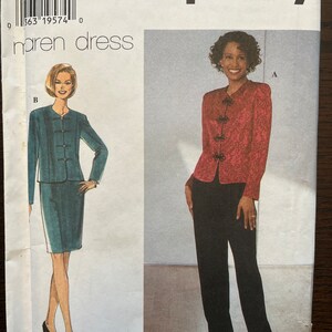 May include: Simplicity pattern for a dress with a jacket. The dress is teal and the jacket is red with black buttons. The pattern is for sizes 14, 16, and 18.