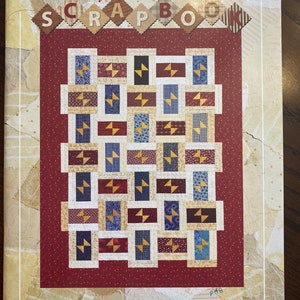May include: A red, white and blue quilt pattern with the title "Kansas City Scrapbook" and the text "Atkinson Designs, one of life's simple pleasures".