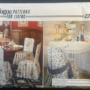 May include: Vogue Patterns for Living sewing pattern number 2374. The pattern includes instructions for making chair covers and table skirts. The chair covers feature a floral print with a ruffled bottom. The table skirt is a blue and white floral print with a lace trim and a blue ribbon.