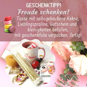 May include: A pink mug with the text "eat sleep dance repeat" in white and pink lettering. The mug is filled with a variety of small gifts, including a hair scrunchie, hair ties, nail polish, and a small bag of bath salts. The gifts are arranged on a pink surface with a bouquet of pink roses and eucalyptus leaves in the background. The text "GESCHENKTIPP! Freude schenken! Tasse mit selbsgebackene Kekse, Lieblingspraline, Gutschein und kleinigkeiten bef&uuml;llen, mit geschenkfolie verpacken..fertig!" is written in white on a pink background.
