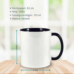 May include: White ceramic mug with a black rim and handle. The mug is 8.5 cm in diameter and 9.5 cm tall. It has a capacity of 325 millilitres.
