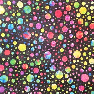 May include: A black fabric with a colorful polka dot pattern. The dots are various sizes and shades of red, yellow, green, blue, and purple.