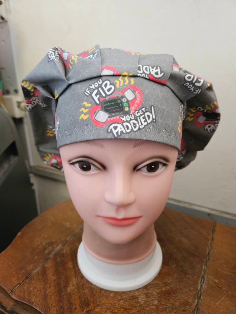 If You Fib, You Get Paddled, cardiac (2 prints) surgical scrub bouffant hat