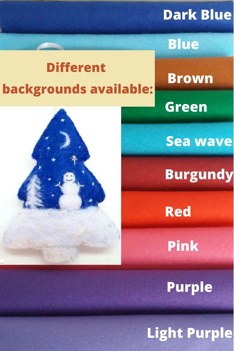 May include: A felt Christmas tree ornament featuring a blue background with a white snowman, a crescent moon, and stars. The base is white with small silver accents. The image includes text stating Different backgrounds available.
