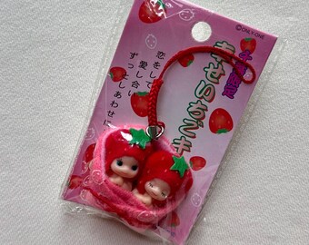 ヴィンテージ ハローキティ ハワイ チャーム：日焼け肌のフラ