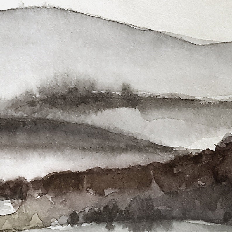 May include: A watercolor painting of a misty mountain landscape in shades of gray and brown. The painting depicts a series of rolling hills and valleys, with a soft, ethereal quality.