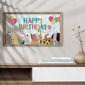 May include: A framed print with a blue background featuring the text "Happy Birthday" in colorful letters. The print also includes a group of animals wearing party hats and surrounded by balloons.