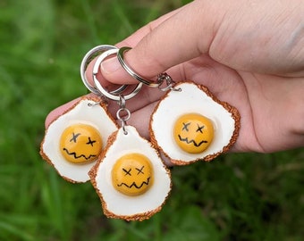 Cracked, Fried Egg clay-keychains