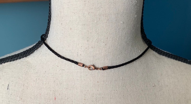 Rhodonite and twisted copper pendant