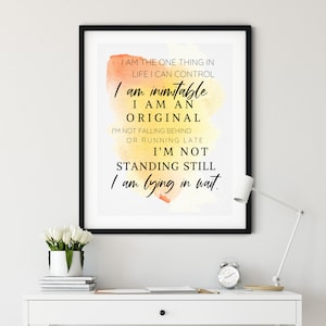 May include: A motivational quote printed on a framed poster with a watercolour background. The quote reads: "I am the one thing in life I can control. I am inimitable. I am an original. I'm not falling behind or running late. I'm not standing still. I am lying in wait."