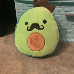 avocado squishmallow with mustache