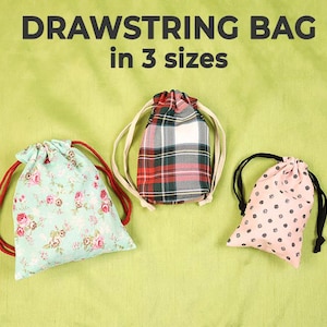 May include: Three drawstring bags in different patterns and sizes are displayed against a green background. The bags include floral, plaid, and polka dot designs. The text "DRAWSTRING BAG in 3 sizes" is at the top.