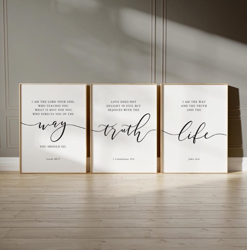 May include: Three framed art prints with gold frames. Each print has a white background with black cursive text. The text includes the words "way", "truth", and "life", along with Bible verses.