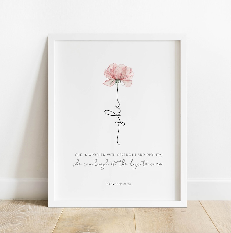 以下が含まれることがあります： ピンクの水彩画の花と「SHE IS CLOTHED WITH STRENGTH AND DIGNITY; she can laugh at the days to come. PROVERBS 31:25」というテキストが書かれた、印刷可能なアートプリントです