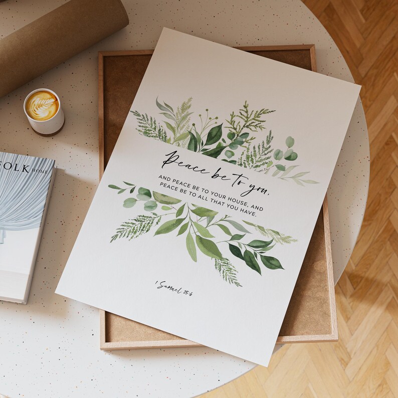 May include: A framed art print with the words "Peace be to you" in elegant script, surrounded by watercolor greenery. The print includes the text "And peace be to your house, and peace be to all that you have" and the reference "1 Samuel 25:6".