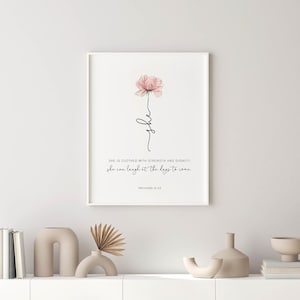 Christian gift for women or mother. It features a pink flower with the bible verse Proverbs 31:25