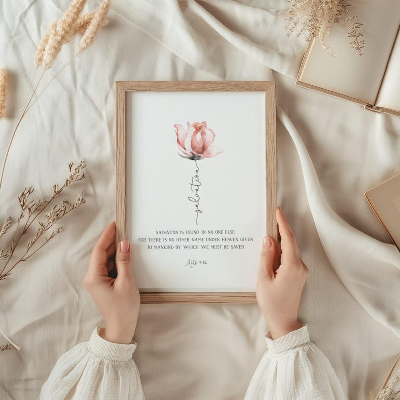 May include: A framed print with a watercolor painting of a pink rose and the text "salvation is found in no one else for there is no other name under heaven given to mankind by which we must be saved Acts 4:12"