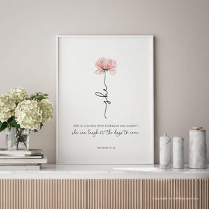 Christian gift for women or mother. It features a pink flower with the bible verse Proverbs 31:25