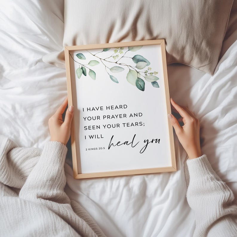 May include: A framed print with a watercolor illustration of green leaves and the text "I HAVE HEARD YOUR PRAYER AND SEEN YOUR TEARS; I WILL heal you" with the scripture reference "2 KINGS 20:5".
