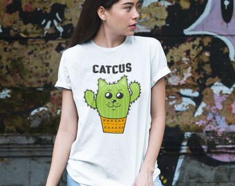 May include: White t-shirt with a green catcus graphic and the text "CATCUS" printed on the front.
