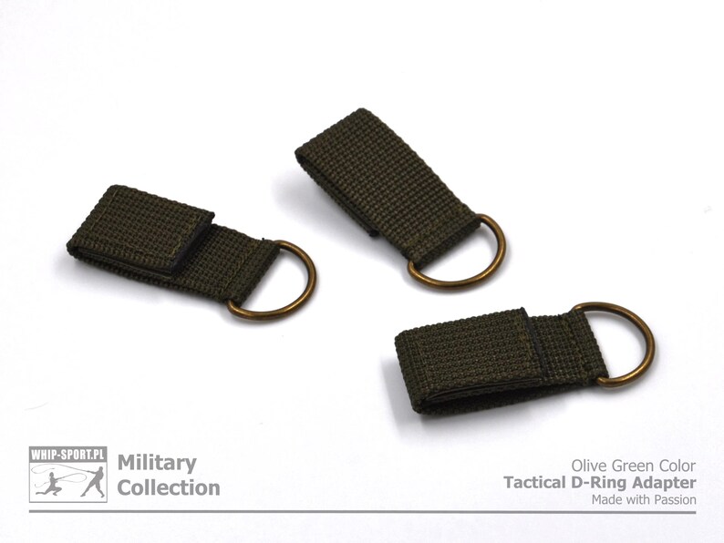 Pode incluir: Tr&ecirc;s adaptadores t&aacute;ticos de anel em D de cor verde oliva com an&eacute;is de lat&atilde;o. Olive Green Color Tactical D-Ring Adapter Made with Passion.
