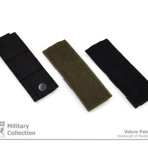 May include: Three Velcro patch panels in black, green, and black. The panels are made of a durable fabric and have a hook and loop closure. The panels are ideal for attaching patches, badges, and other accessories to your gear.