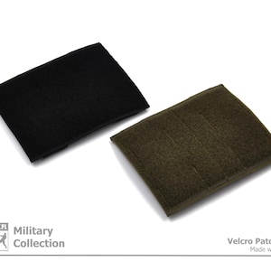 Peut inclure: Deux panneaux de patch velcro noir et vert. Les panneaux sont faits d'un tissu doux et textur&eacute;. Le texte "Velcro Patch Panel Made with Passion" est imprim&eacute; sur un fond blanc sous les panneaux.