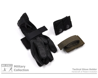 May include: Black tactical gloves with a black velcro strap and a green tactical glove holder. The glove holder has a velcro strap and is labeled "Tactical Glove Holder Handcraft of Modern Evolution".