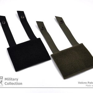 Peut inclure: Deux panneaux de patchs en velcro, un noir et un vert, avec une conception en boucle pour fixer des patchs. Les panneaux ont des sangles r&eacute;glables avec une fermeture &agrave; bouton.