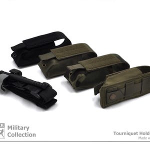 May include: Four green and black tactical tourniquet holders with a black tourniquet and a grey strap. The text on the image reads "Military Collection" and "Tourniquet Holder - CAT Made with Passion".
