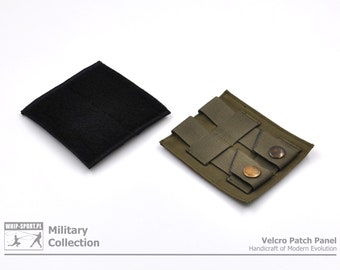 May include: A green velcro patch panel with two metal snaps. The panel is designed to be attached to a bag or other piece of gear. The panel is made of durable nylon and has a loop side velcro backing. The panel is part of the Military Collection.