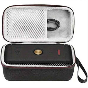 May include: Black rectangular device with a gold button and red indicator light, inside a black zippered case with a mesh pocket and a black cable. The case has a handle and a red trim.